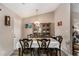 Formal dining room includes a large table with seating for eight and a china cabinet at 25 Bridlewood Ct, Stockbridge, GA 30281