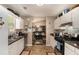 Kitchen features stainless steel appliances and an open view to dining room at 25 Bridlewood Ct, Stockbridge, GA 30281