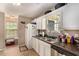 This functional kitchen includes a stainless steel dishwasher, granite countertops and a window at 25 Bridlewood Ct, Stockbridge, GA 30281