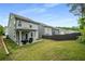 Spacious backyard featuring a patio, wooden fence, and plenty of room for outdoor activities at 4422 Richmond Se Ct, Stone Mountain, GA 30083
