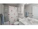 bathroom featuring a shower curtain, sink with storage, and modern vanity at 4422 Richmond Se Ct, Stone Mountain, GA 30083
