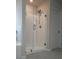Bathroom featuring a walk in shower with glass doors and tiled floors at 4422 Richmond Se Ct, Stone Mountain, GA 30083