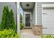Inviting front porch with decorative pillars, lush greenery, and a welcoming entrance at 4422 Richmond Se Ct, Stone Mountain, GA 30083