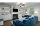 Cozy living room featuring a fireplace, built-in shelving, and comfortable blue seating at 4422 Richmond Se Ct, Stone Mountain, GA 30083
