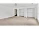 Carpeted bedroom with closet and natural light at 7737 Bar Harbor Dr, Riverdale, GA 30296