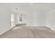 Bright bedroom showcasing neutral walls, large arched windows, and cozy carpeting at 7737 Bar Harbor Dr, Riverdale, GA 30296