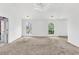 Spacious bedroom with large windows, plush carpet, and neutral color palette at 7737 Bar Harbor Dr, Riverdale, GA 30296