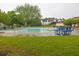Community swimming pool with picnic tables and green space surrounding the pool at 7737 Bar Harbor Dr, Riverdale, GA 30296