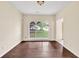 Elegant dining room featuring dark wood floors and an arched window at 7737 Bar Harbor Dr, Riverdale, GA 30296