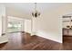 Open-concept dining area with decorative lighting and access to the kitchen at 7737 Bar Harbor Dr, Riverdale, GA 30296