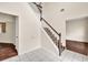Bright foyer featuring tile flooring, staircase, and views to the dining and living room at 7737 Bar Harbor Dr, Riverdale, GA 30296