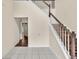 Bright foyer showcasing staircase with wood treads and white risers at 7737 Bar Harbor Dr, Riverdale, GA 30296