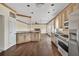 Modern kitchen features granite countertops, stainless steel appliances, and hardwood flooring at 7737 Bar Harbor Dr, Riverdale, GA 30296