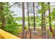 View of the lake from the deck and backyard, with a gazebo-like seating area at 7737 Bar Harbor Dr, Riverdale, GA 30296