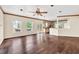 Open living area displaying hardwood floors, a fireplace, and an open kitchen at 7737 Bar Harbor Dr, Riverdale, GA 30296