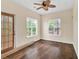 Bright sunroom with hardwood floors, large windows, and a door to the outside at 7737 Bar Harbor Dr, Riverdale, GA 30296