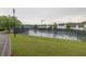 View of tennis courts with well-maintained green surroundings and residential buildings at 7737 Bar Harbor Dr, Riverdale, GA 30296