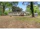 Spacious backyard featuring a well-maintained lawn and mature trees at 808 Casplan Sw St, Atlanta, GA 30310