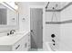 Elegant bathroom featuring a tub with mosaic tile accents, a vanity with quartz countertop, and stylish fixtures at 808 Casplan Sw St, Atlanta, GA 30310