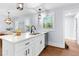 Open kitchen with stainless steel dishwasher and stone countertops at 808 Casplan Sw St, Atlanta, GA 30310