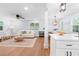 Bright, open floor plan with hardwood floors; the living room flows into the dining area at 808 Casplan Sw St, Atlanta, GA 30310