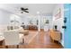 Inviting living space with hardwood floors, neutral décor, and an open layout to the dining area at 808 Casplan Sw St, Atlanta, GA 30310