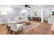 Bright, open-concept living room featuring hardwood floors, neutral tones, and contemporary furnishings at 808 Casplan Sw St, Atlanta, GA 30310