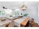 Open-concept living and dining area with hardwood floors and abundant natural light at 808 Casplan Sw St, Atlanta, GA 30310