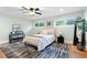 Light-filled main bedroom featuring hardwood floors and a modern accent rug at 808 Casplan Sw St, Atlanta, GA 30310