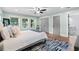 Tranquil main bedroom with natural light, hardwood flooring, and ensuite bathroom at 808 Casplan Sw St, Atlanta, GA 30310