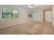 Spacious bedroom featuring two large windows and neutral carpeting at 1131 Bailing Dr, Lawrenceville, GA 30043