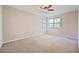 Bedroom featuring neutral carpet, natural light, and ceiling fan at 1131 Bailing Dr, Lawrenceville, GA 30043