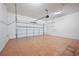 Spacious garage with an automatic door and tile flooring offers ample parking and storage at 1131 Bailing Dr, Lawrenceville, GA 30043