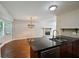 Open kitchen with granite countertops, stainless steel dishwasher, and adjacent breakfast area at 1131 Bailing Dr, Lawrenceville, GA 30043