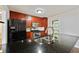 Well-equipped kitchen boasts stainless steel appliances, a black refrigerator and granite countertops at 1131 Bailing Dr, Lawrenceville, GA 30043