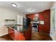 Kitchen featuring stainless steel appliances, granite countertops, and wood cabinetry at 1131 Bailing Dr, Lawrenceville, GA 30043