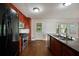 Charming kitchen features stainless steel appliances, wood cabinets and hardwood floors at 1131 Bailing Dr, Lawrenceville, GA 30043