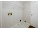 Clean, functional laundry room with tile flooring and utility connections at 1131 Bailing Dr, Lawrenceville, GA 30043