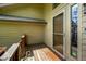 Exterior view of the porch with wood decking, siding, and door with decorative glass at 1131 Bailing Dr, Lawrenceville, GA 30043
