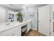 Bright bathroom features double sink vanity with white cabinets and quartz countertop at 2815 Habibi Ct, Buford, GA 30519
