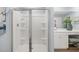Bathroom with a double sink vanity and glass door shower with built-in shelves at 2815 Habibi Ct, Buford, GA 30519