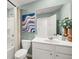 Clean bathroom features a shower, toilet, and modern vanity with stylish art and plants at 2815 Habibi Ct, Buford, GA 30519