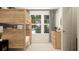This bedroom features a wooden bunk bed, a neutral color palette, and ample natural light for a serene retreat at 2815 Habibi Ct, Buford, GA 30519
