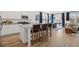 Open-concept kitchen with island, stainless steel appliances, breakfast bar, and an adjacent dining area at 2815 Habibi Ct, Buford, GA 30519