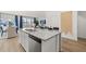 Bright kitchen showcasing an island, stainless steel appliances, and open layout to the dining and living areas at 2815 Habibi Ct, Buford, GA 30519