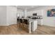Modern kitchen with a spacious island, stainless steel appliances, and pristine white cabinetry at 2815 Habibi Ct, Buford, GA 30519
