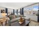 Bright living room with large windows, comfortable seating, and modern decor at 2815 Habibi Ct, Buford, GA 30519