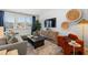 Stylish living room showcasing a comfortable sectional sofa, statement wall decor, and large windows at 2815 Habibi Ct, Buford, GA 30519