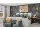 Comfortable main bedroom with king bed, armchairs, decorative lamps and accent wall at 2815 Habibi Ct, Buford, GA 30519