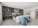 Comfortable main bedroom with accent wall, seating, and ample natural light at 2815 Habibi Ct, Buford, GA 30519